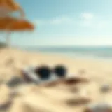 A serene beach with a book and sunglasses on the sand