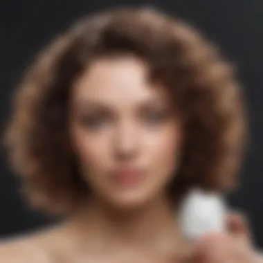Close-up of a woman applying a curl defining cream to her short curls