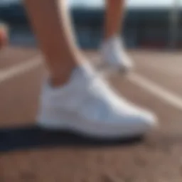 Stylish white running sneakers on a track