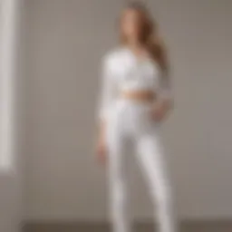 Chic display of white high-waisted straight leg jeans styled with a trendy top.