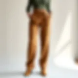 Stylish high-waist khaki pants on a minimalist backdrop