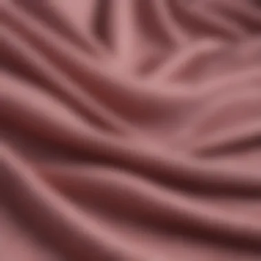 A close-up of fabric textures representing sustainable materials used in gender-neutral fashion.