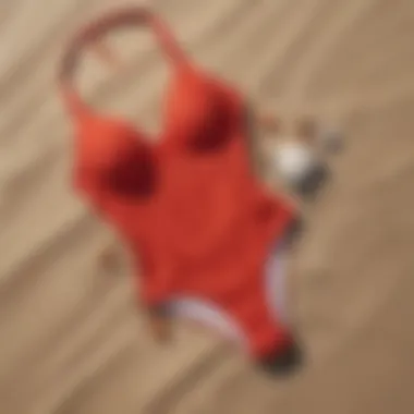 Elegant red high cut swimwear on a sandy beach