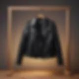 A stylish black leather jacket on a wooden hanger, symbolizing timeless fashion