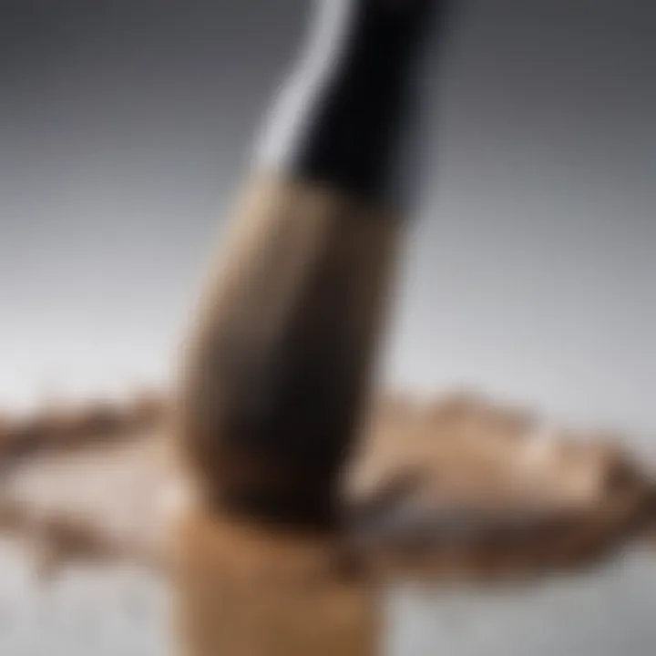 Close-up of a brush being cleaned in soapy water