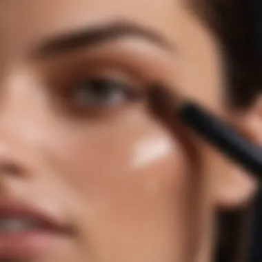 Close-up of NARS concealer being applied with a brush