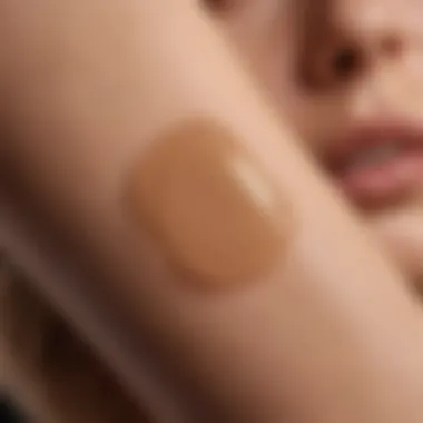 Swatch of tan lotion applied on pale skin
