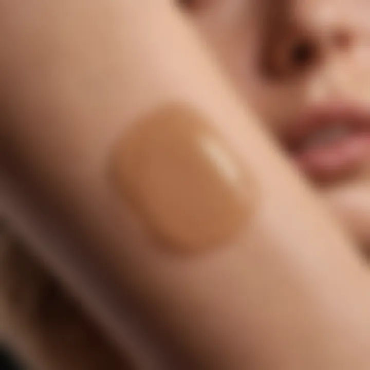 Swatch of tan lotion applied on pale skin