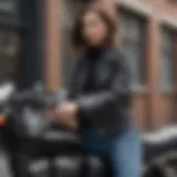 A stunning cropped leather biker jacket displayed on a vintage motorcycle