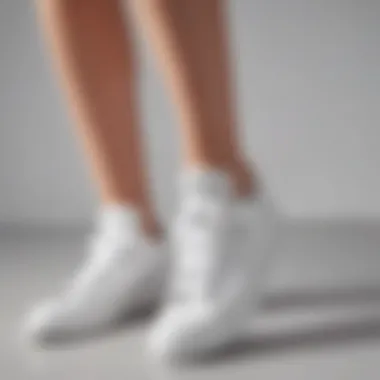 Woman showcasing versatile outfit with white sneakers