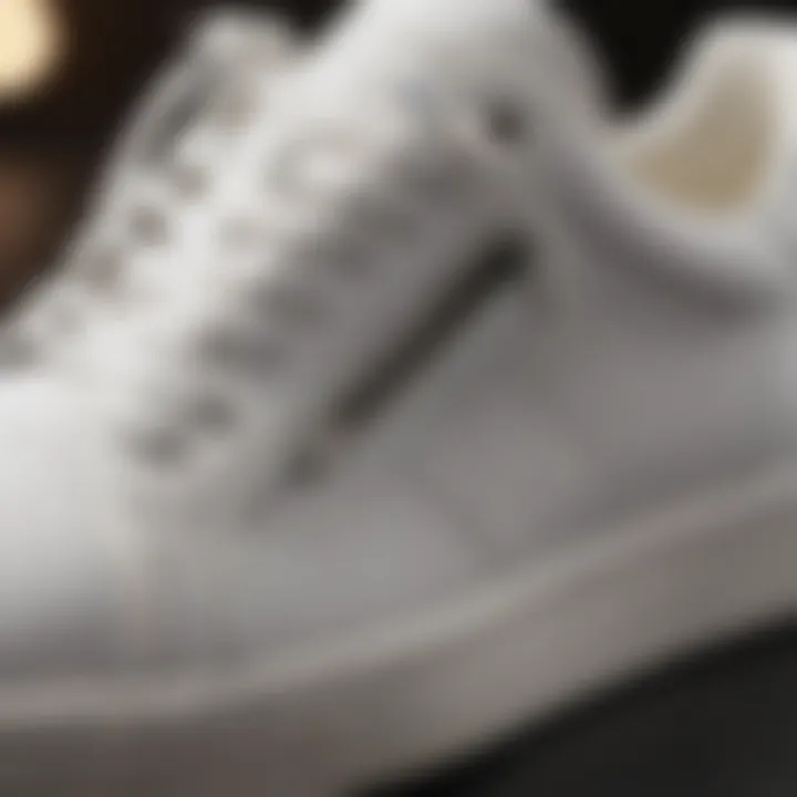 Close-up view highlighting the unique design features of white leather trainers.